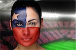 Composite image of beautiful chile fan in face paint against large football stadium with fans in blue