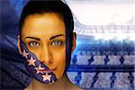 Composite image of beautiful bosnia fan in face paint against large football stadium with lights