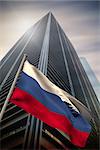 Russia national flag against low angle view of skyscraper