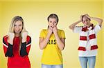Composite image of football fans in red against yellow vignette