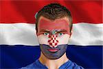 Composite image of serious young croatia fan with facepaint against digitally generated croatia national flag