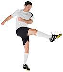 Football player in white kicking on white background