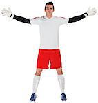 Goalkeeper in white ready to save on white background