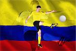 Football player in yellow kicking against digitally generated colombia national flag