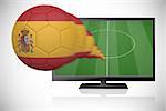Football in spain colours flying out of tv against white background with vignette