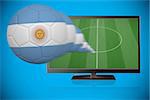 Football in argentina colours flying out of tv against blue background with vignette
