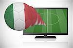 Football in italy colours flying out of tv against white background with vignette