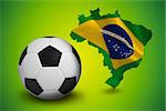 Black and white football against green brazil outline with flag