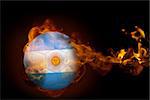 Composite image of fire surrounding argentina ball against black