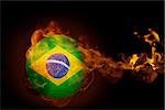 Composite image of fire surrounding brasil ball against black