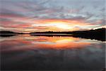 Beautiful sunrise and mirror reflections on Narrabeen Lakes NSW Australia