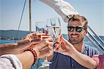 People on sailboat, drinking champagne, toasting, Adriatic Sea, Croatia