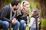 Family with son sitting on a park bench, Osijek, Croatia