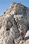 Two female alpinists rock climbing, Innsbruck route, Tyrol, Austria