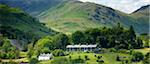 Cottages in Langdale Pass surrounded by Langdale Pikes in the Lake District National Park, Cumbria, UK