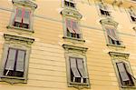 Traditional architecture and window shutters Via Cesare Battisti in Lucca, Italy