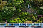 Pilgrim at Grotto of the Virgin Mary and The Immaculate Conception at Ballinspittle near Kinsale, County Cork, Ireland