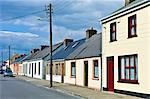 Street scene pastel painted terraced homes in Kilkee, County Clare, West of Ireland