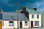 Street scene pastel painted terraced homes in Kilkee, County Clare, West of Ireland