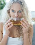 Portrait of young woman drinking herbal tea