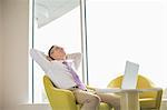 Mature businessman relaxing in lobby