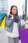 Portrait of beautiful woman carrying shopping bags