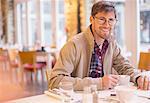 Man enjoying cup of coffee in cafe