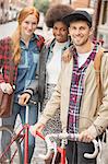 Friends smiling together on city street