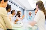 Business people clapping in meeting