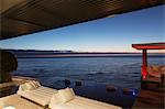 Sofas and infinity pool overlooking ocean