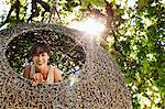 Woman smiling in nest tree house