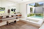 Modern bathroom overlooking luxury soaking pool