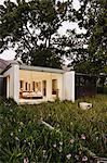 Grass and tree surrounding modern house