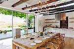 Chandelier over dining table in modern house