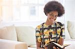 Woman reading on sofa