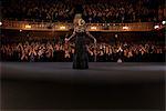 Violinist  performing on stage in theater