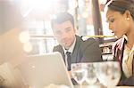 Businessman smiling in restaurant