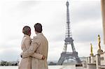 Couple admiring Eiffel Tower, Paris, France