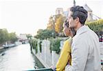 Couple looking at Seine River, Paris, France