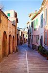 Narrow street in the old Mediterranean town Alcudia, Majorca island