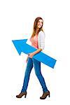 Beautiful woman walking while holding a blue arrow