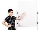 young boy student in a classroom showing on a empty white board
