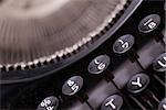 Close up photo of antique typewriter keys, shallow focus, natural colors