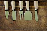 cheese knife set on a wooden background