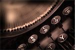 Close up photo of antique typewriter keys, shallow focus, warm
