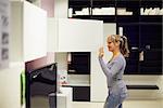 young hispanic woman shopping for furniture, sofa and home decor in store