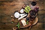 Cheese variety. Food background.  Fresh ingredients on wood