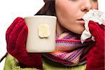 Young Sick Woman with Tissue Holding Cup with Blank Tea Bag Hanging.