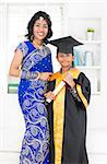 Kindergarten graduation. Asian Indian family, mother and son on kinder graduate day.