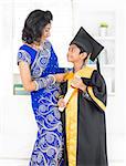 Kindergarten graduation. Asian family, Indian mother and son on kinder graduate day.